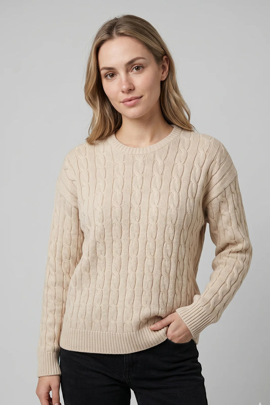 Cream cable knit sweater for women with classic textured knit pattern and ribbed cuffs, designed and made in Canada.