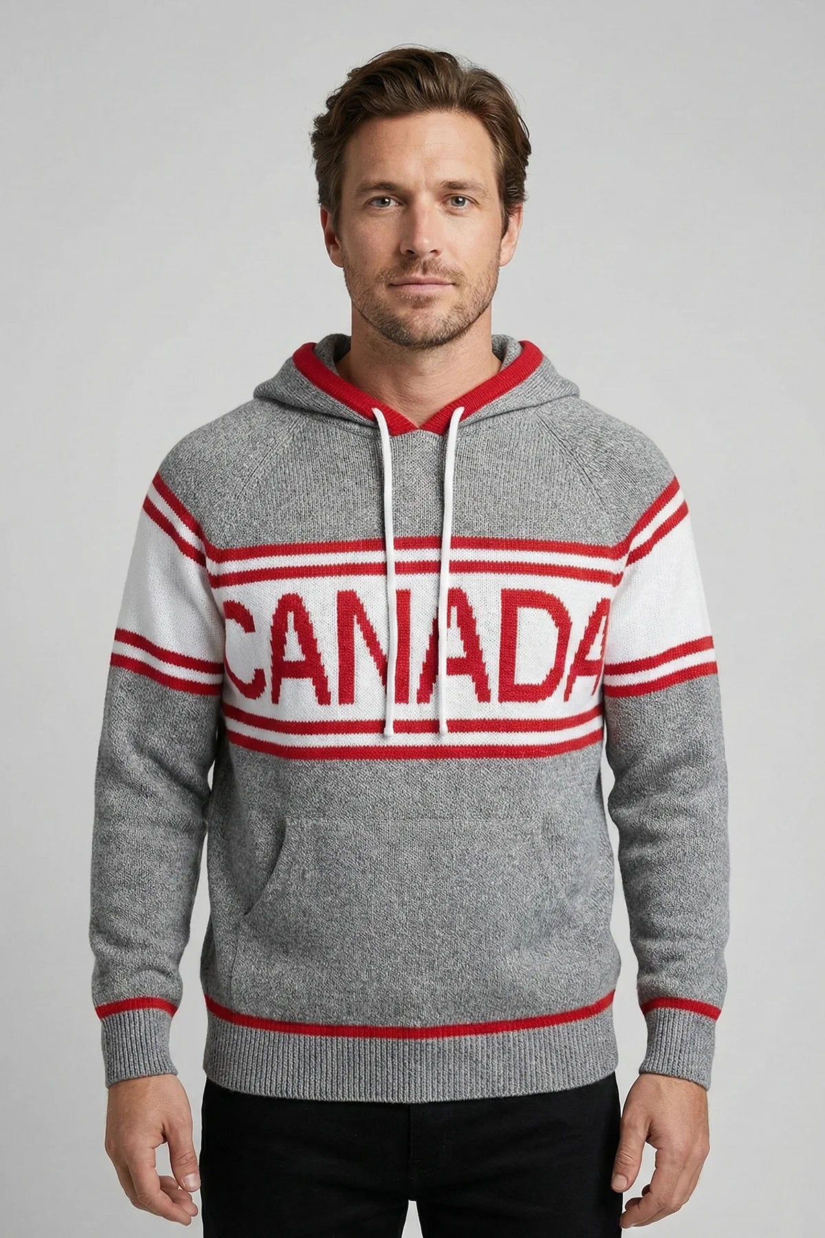 Man wearing a gray hoodie with 'Canada' printed on it against a plain background