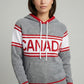 Person wearing a gray hoodie with 'Canada' printed on it against a plain background