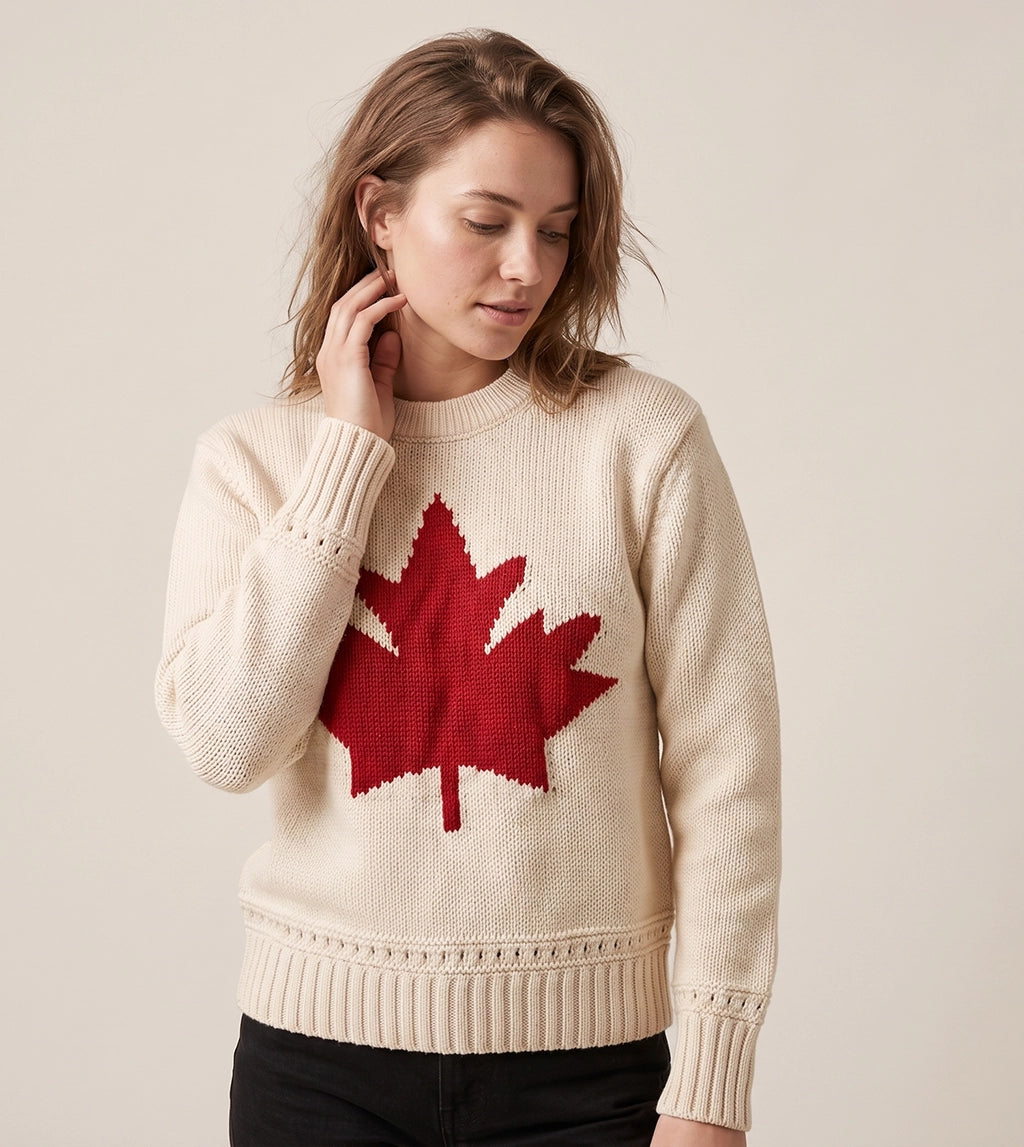 Women’s cream Canadian maple leaf sweater with large red maple leaf design on the front.