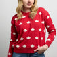Front view of Falling Maples Sweater featuring an all-over maple leaf knit pattern with ribbed crewneck, cuffs, and hem.