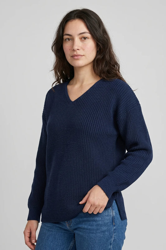 Women’s navy fisherman sweater with textured knit design and relaxed V-neck fit, made in Canada from 100% cotton.