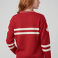 Back view of red Legacy Hockey Sweater with white stripe detailing on the back and sleeves.