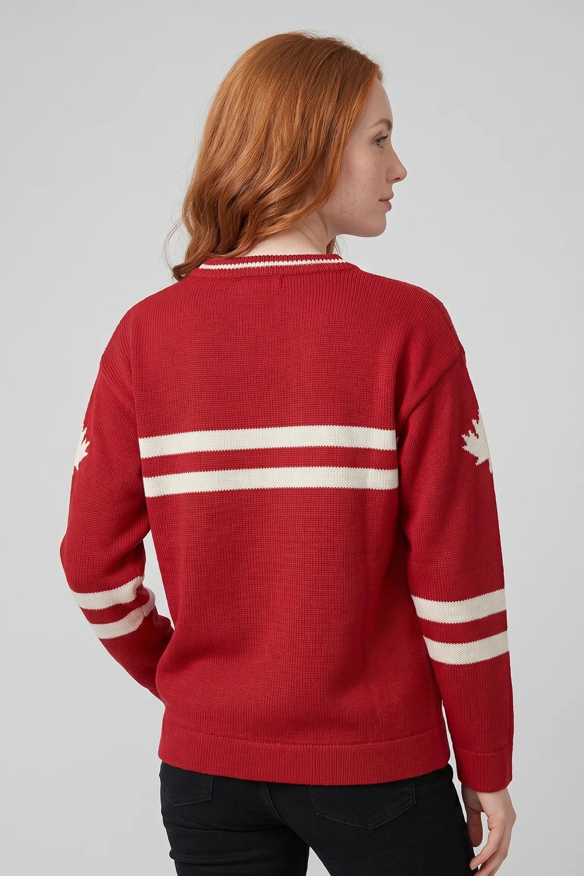Back view of red Legacy Hockey Sweater with white stripe detailing on the back and sleeves.