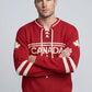 Man wearing red Legacy Hockey Sweater with white maple leaf graphic and traditional hockey sweater styling.