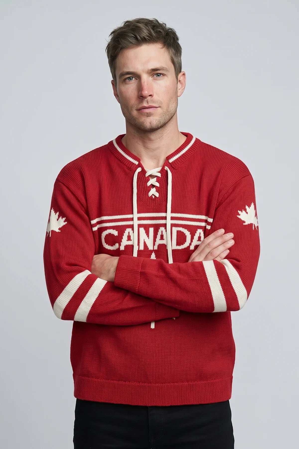 Man wearing red Legacy Hockey Sweater with white maple leaf graphic and traditional hockey sweater styling.