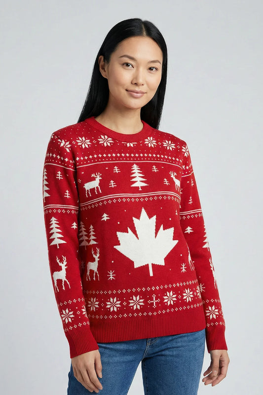 Person wearing a red sweater with a maple leaf design on a plain background