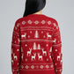 Person wearing a red sweater with reindeer and tree pattern on a gray background