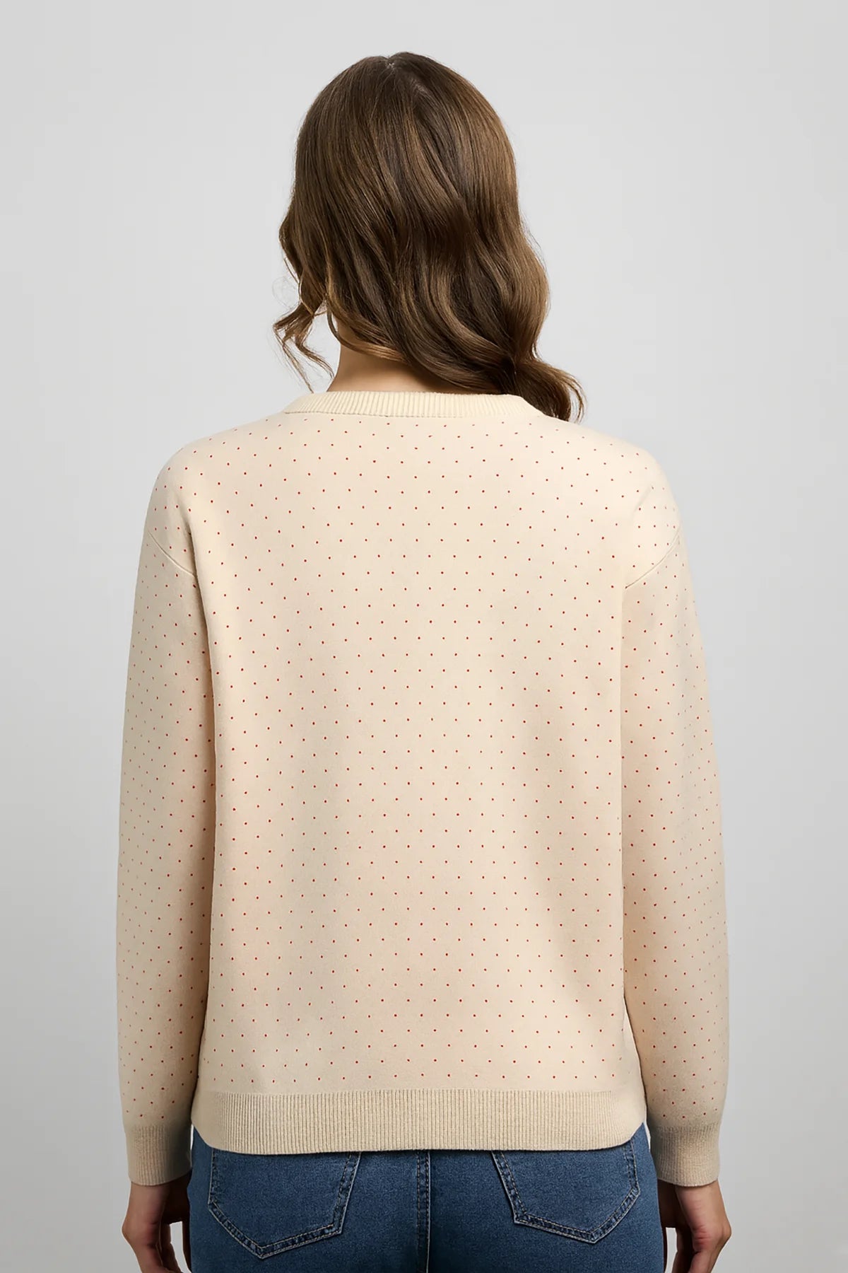 Back view of Falling Maples Sweater featuring an all-over knit design with subtle dotted detailing, a cozy crewneck style, and ribbed hem and cuffs.