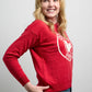 Side view of Sweater 1867 showcasing knit fabric with dotted detailing and bold maple leaf crest design on the front.