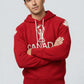 Man wearing a red hoodie with 'Canada' and a maple leaf design on a light gray background