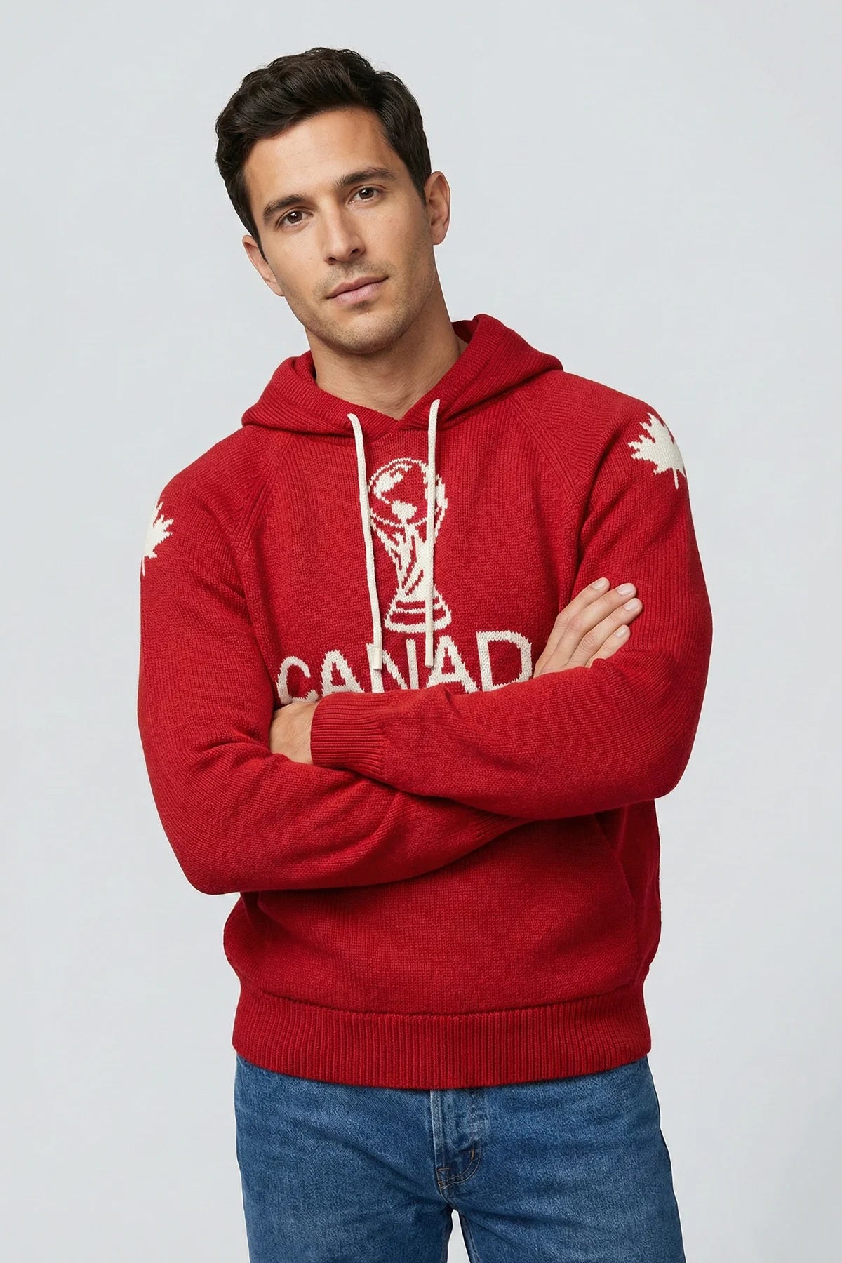 Man wearing a red hoodie with 'Canada' and a maple leaf design on a light gray background